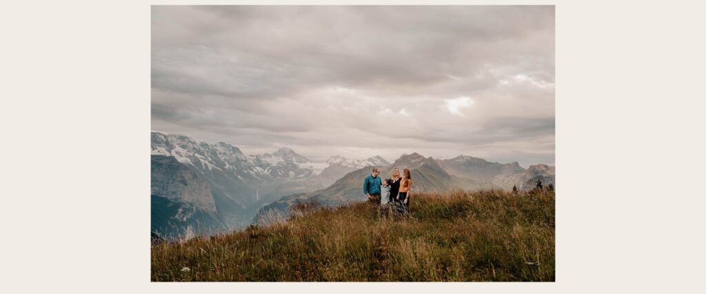 Family at sunset in the Swiss Alps at Schynige Platte overlooking Lauterbrunnen Valley