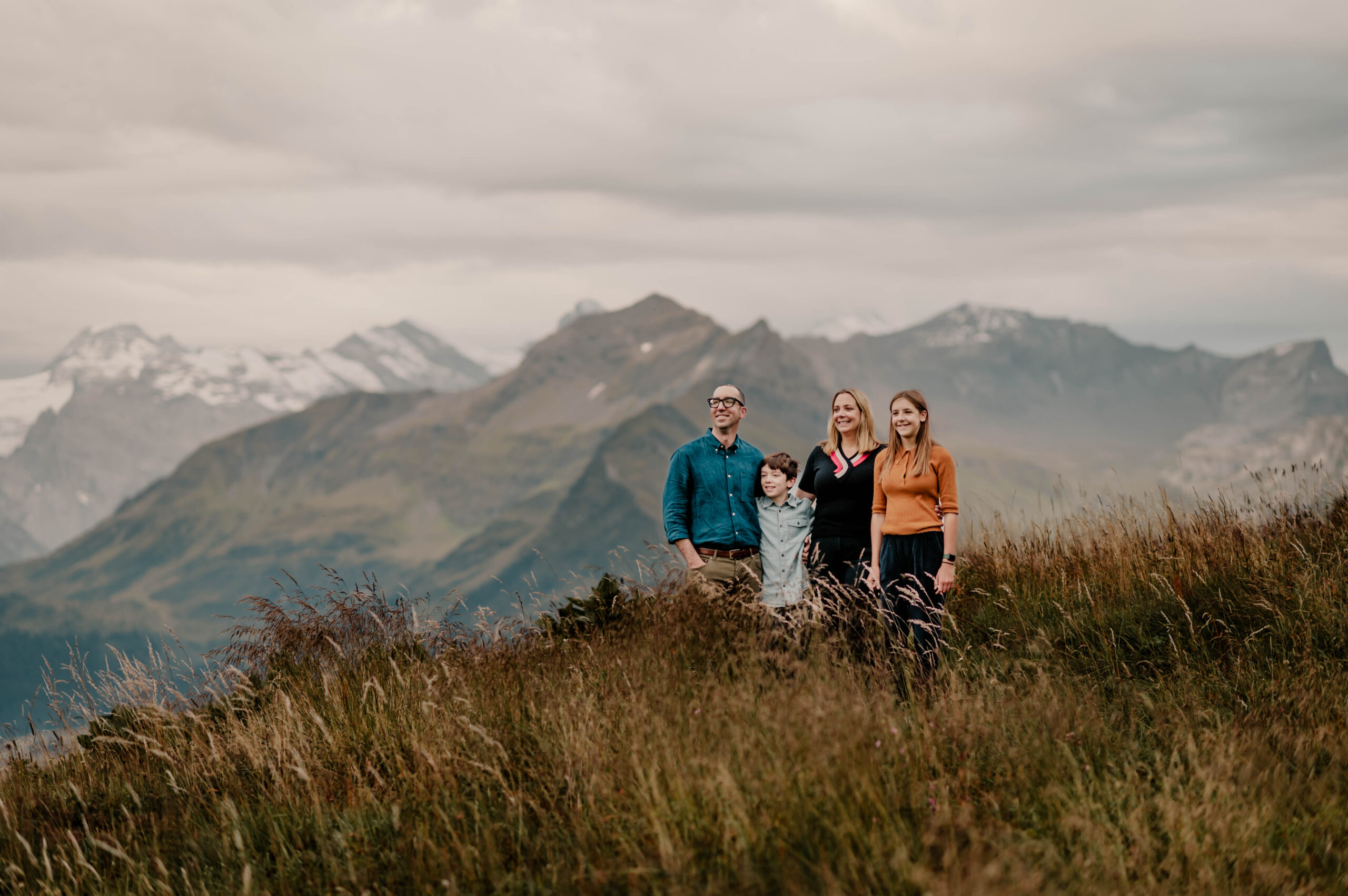 Sunset view over the Swiss Alps from Schynige Platte, showcasing the stunning Eiger, Mönch, and Jungfrau peaks, ideal for family photo sessions.